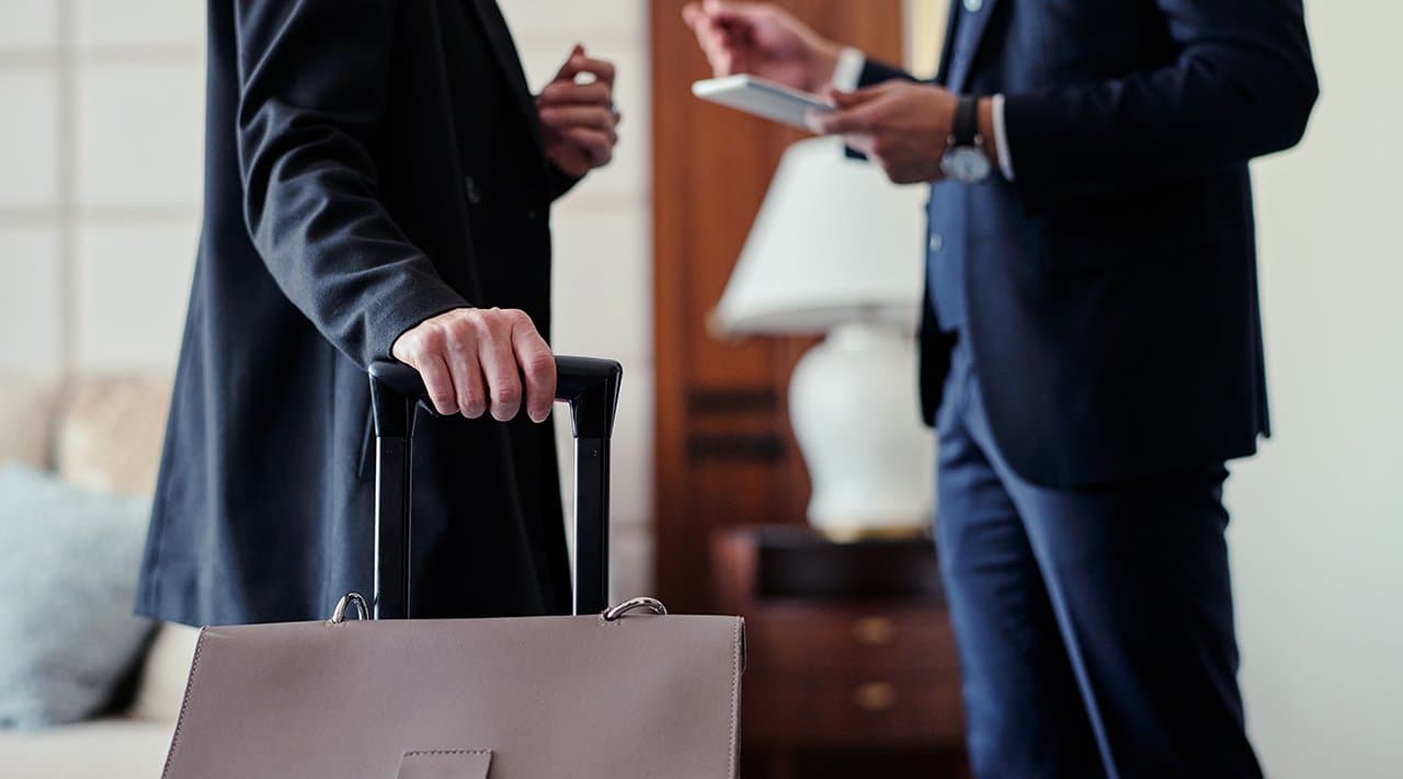 Guests arriving with luggage at a managed property